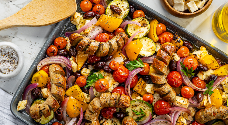 Al Fresco Greek Sheet pan dinner on a counter featuring Italian Chicken Sausage